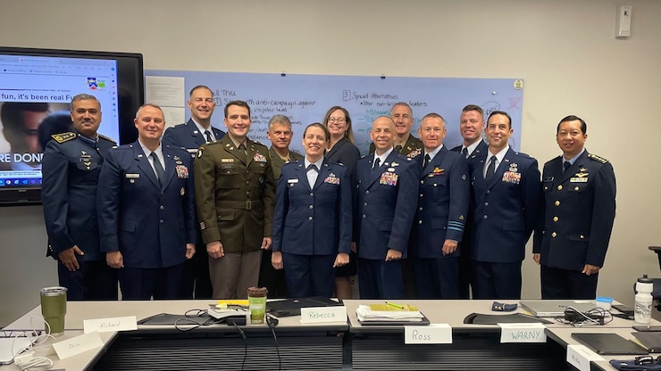 Air War College seminar students gathered together for a group photo before meeting incoming guests for the 2024 National Security Forum.
