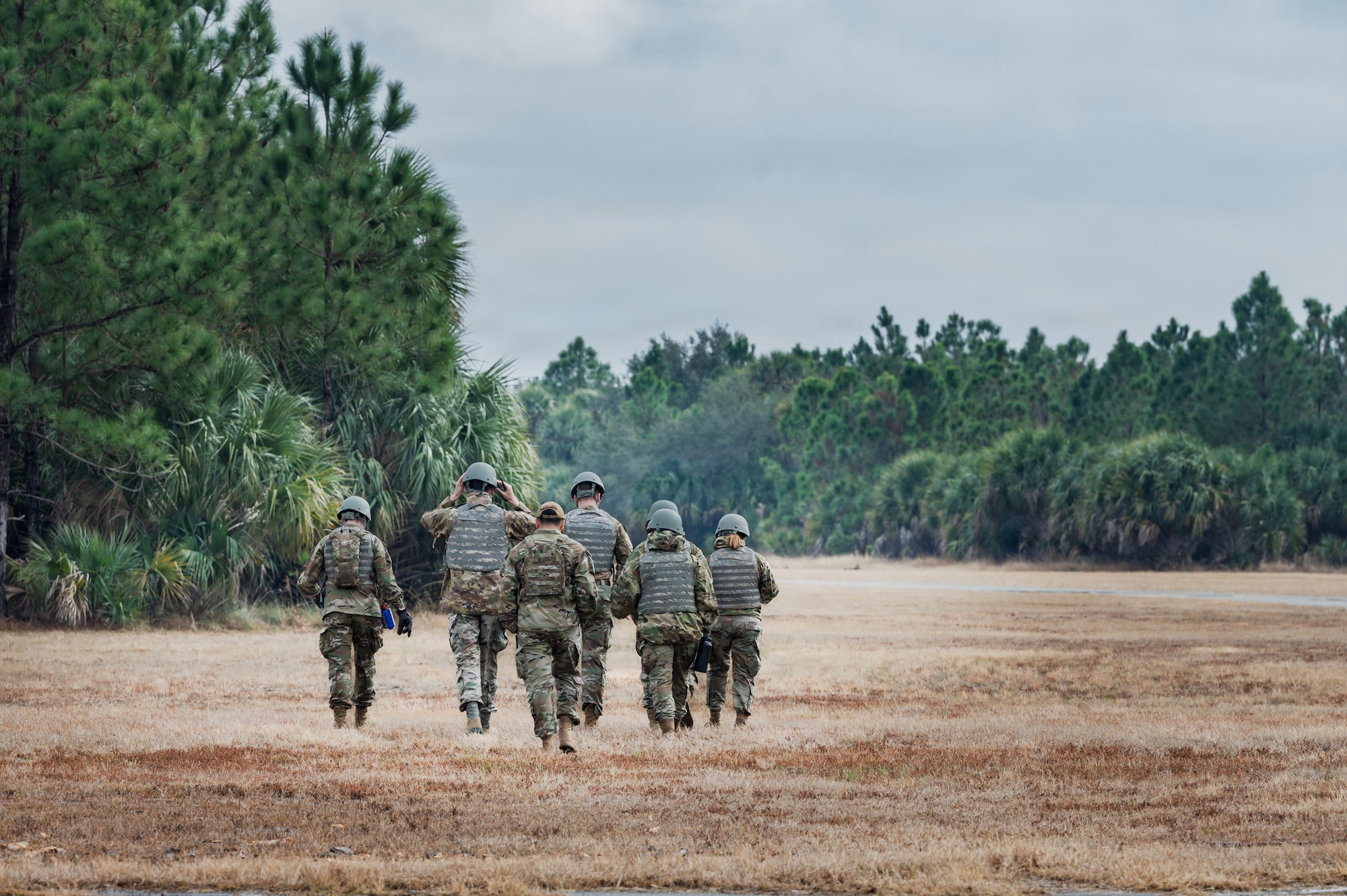 Airman Leadership School students advance as a team during a field training exercise at Malabar Training Site, Florida, Feb. 5, 2026. The exercise challenged students to apply mission command principles, communicate effectively, and lead across multiple career fields in a simulated high-stress operational environment. (U.S. Space Force photo by Gwen Kurzen)