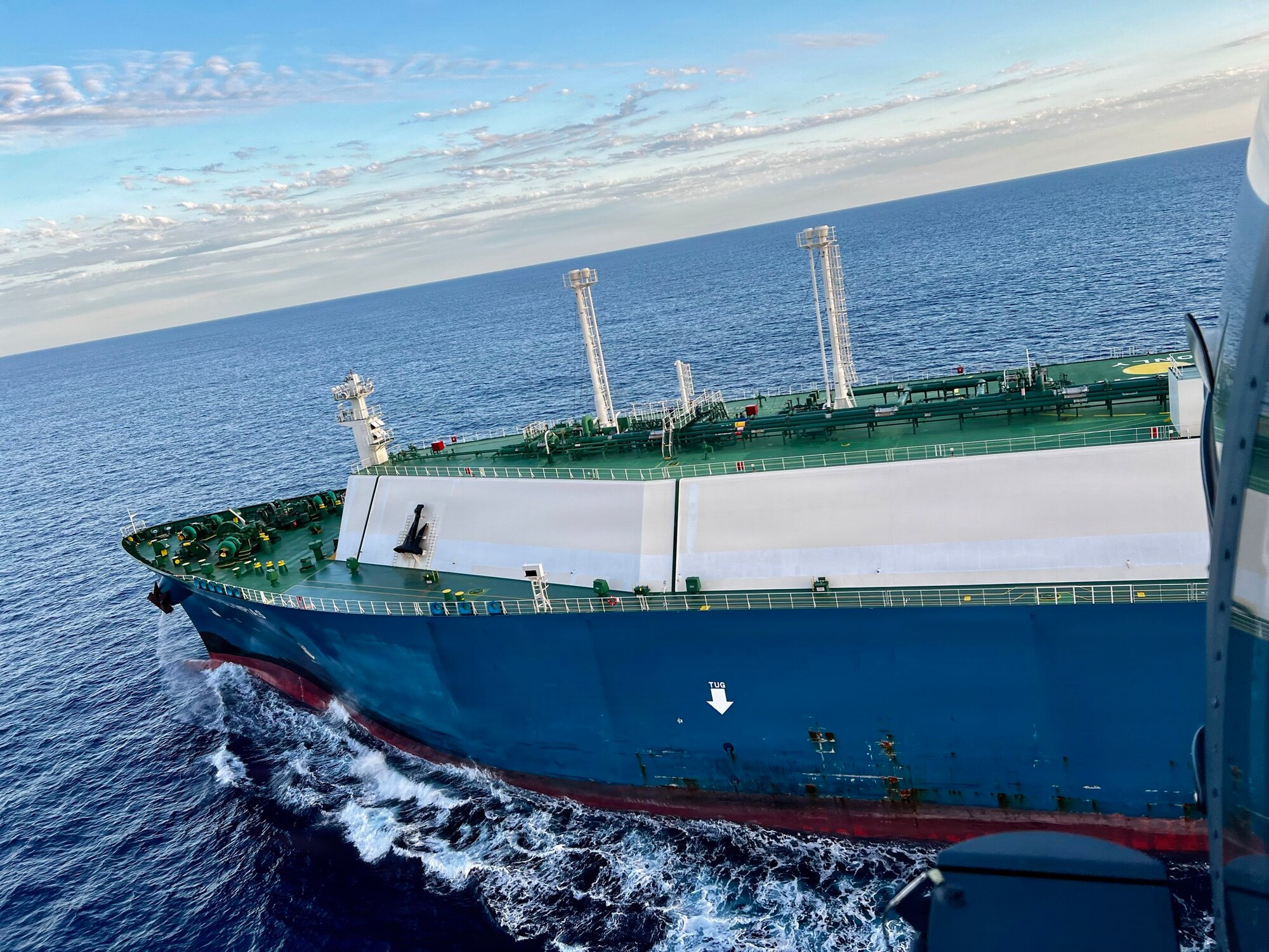 A team of U.S. Air Force pararescuemen prepare to hoist down on a tanker during a rescue mission off the coast of Baja California, Mexico, Feb. 5, 2026. The location required pararescuemen to hoist onto the moving vessel to rescue the patient. (Courtesy photo)