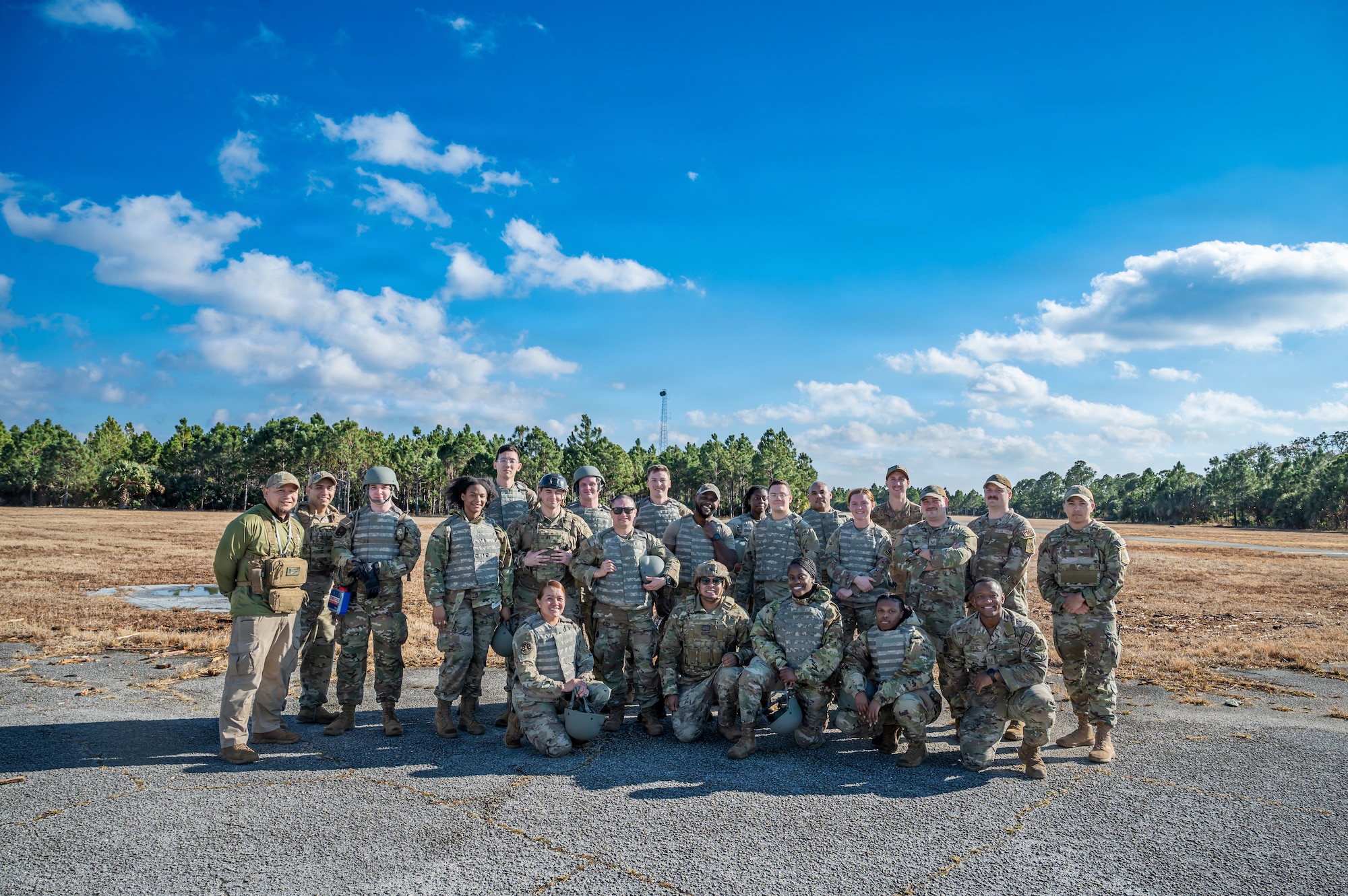 Airman Leadership School students and instructors pose for a group photo following a field training exercise at Malabar Training Site, Florida, Feb. 5, 2026. The exercise provided students the opportunity to apply mission command principles, strengthen leadership skills, and operate in a high-stress, simulated operational environment.