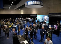 West 2026 attendees mingle through the Navy Information Warfare (IW) Pavilion, Feb 10. The IW pavilion demonstrated the Navy's commitment to warfighting in the information age through the use of speakers, panels, subject matter experts, and capability displays. The premier naval conference and exposition on the WEST Coast, WEST is now in its 36th year of bringing military and industry leaders together. Co-sponsored by AFCEA International and the U.S. Naval Institute, WEST is the only event in which the makers of platforms and the designers of technologies can network, discuss, and demonstrate their solutions in a single locale. (U.S. Navy photo by Robert Fluegel / Released)