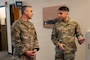 U.S. Air Force Chief Master Sgt. Shawn M. Aiello, left, Air Force Global Strike Command command chief, talks with Senior Airman Alejandro Puente San, 2nd Force Support Squadron personnelist, during a tour of the military personnel flight at Barksdale Air Force Base, Louisiana, Feb. 3, 2026. Aiello is the command’s senior enlisted leader and principal advisor to the commander on issues impacting Airmen's welfare, visits like this enable him to get a touch point with the ground level force and allow Airmen to gain strategic insight on their role in AFGSC. (U.S. Air Force photo by Senior Airman Seth Watson)