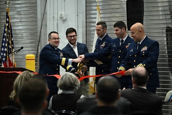 Coast Guard Rear Adm. Russell E. Dash (left), commander of the Great Lakes District, joins the official party for the ribbon-cutting ceremony for the newly built Station and Aids to Navigation Team Buffalo building on Jan. 12, 2026. U.S. Coast Guard photo by Petty Officer 2nd Class Omar Faba.
