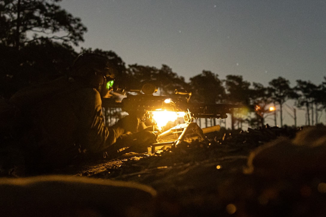 U.S. Marines with 3rd Battalion, 2nd Marine Regiment, 2nd Marine Division fire an M240B medium machine gun during a live fire exercise at night as part of a Marine Corps Combat Readiness Evaluation on Marine Corps Base Camp Lejeune, North Carolina, Nov. 6, 2025. Marines and Sailors with 2nd Marine Regiment, 2nd MARDIV conducted the MCCRE in order to demonstrate combat proficiency through the combined use of modern infantry tactics and technology, ensuring readiness for any future conflict or operation. (U.S. Marine Corps photo by Lance Cpl. Dominic Trujillo)