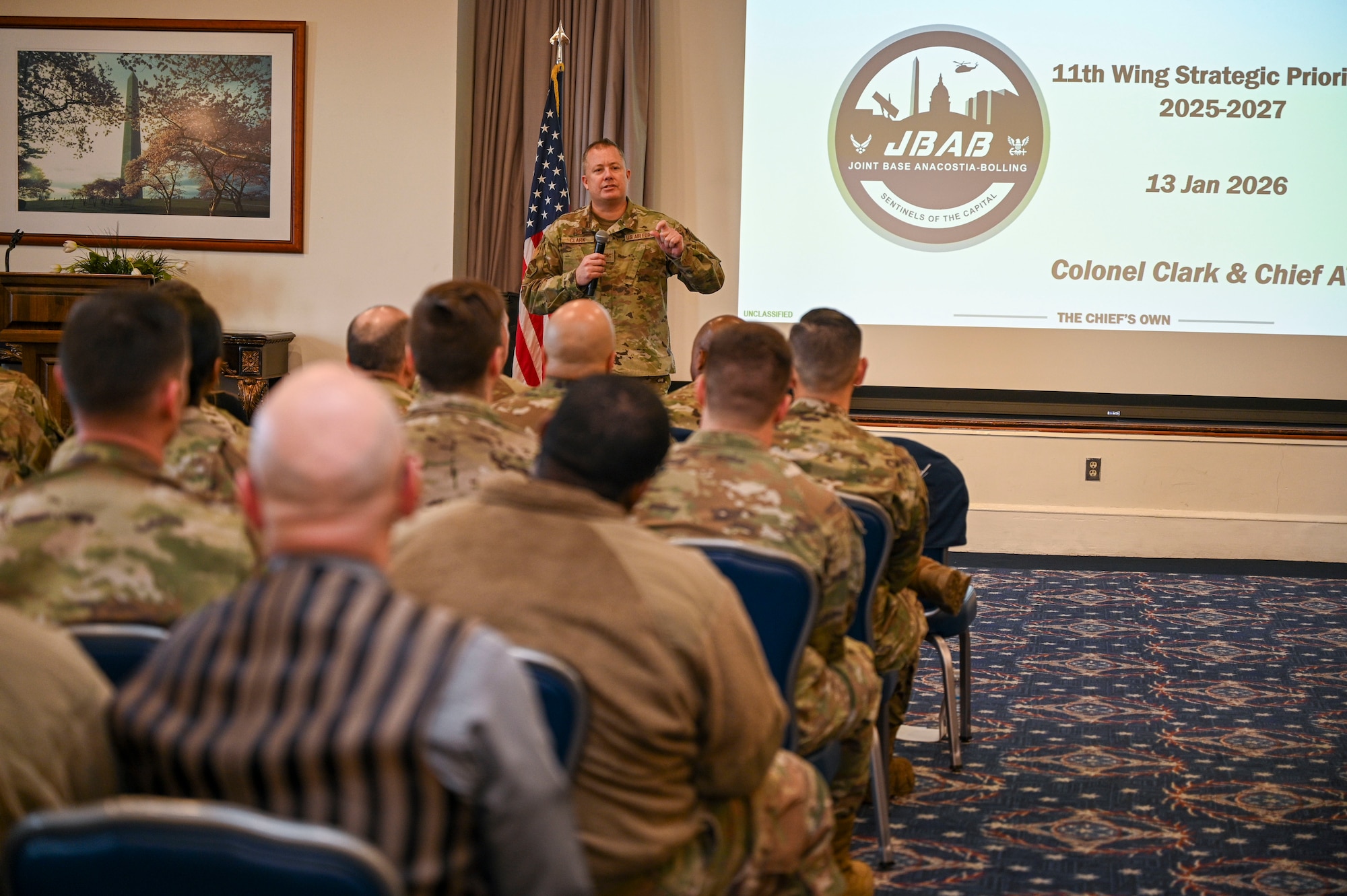 U.S. Air Force Col. James M. Clark, commander of Joint Base Anacostia-Bolling and the 11th Wing, answers questions during a wing all-call at JBAB, Washington, D.C., Jan. 13, 2026. Clark laid out his priorities to the wing which included a focus on mission, people, installation and community. (U.S. Air force photo by Airman 1st Class Shanel Toussaint)