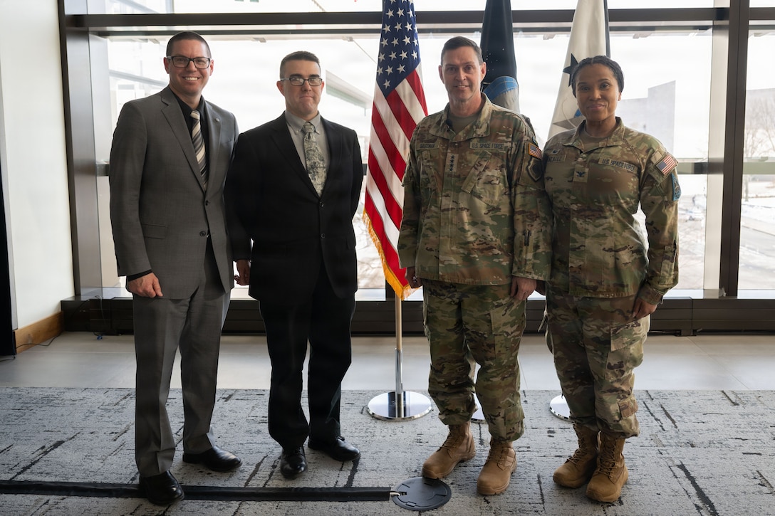 From left, U.S. Space Force Lt. Col. Bradley Thrush, vice commandant of Space Delta 13 Detachment 3, U.S. Space Force Col. Kirk Johnson, commandant of Space Delta 13 Detachment 3, U.S. Space Force Chief of Space Operations Gen. Chance Saltzman  and U.S. Space Force Col. Alison Gonzalez, commander of Space Delta 13, pose for a group photo following a lecture at Johns Hopkins University in Washington, D.C., Feb. 4, 2026. Space Delta 13 Detachment 3 hosted Saltzman as part of the Commandant’s Lecture Series, which provided students an opportunity for mentorship and historical perspectives from top Space Force leadership responsible for the nation’s space assets. (U.S. Air Force photo by Airman 1st Class Mauricio Hidalgo)