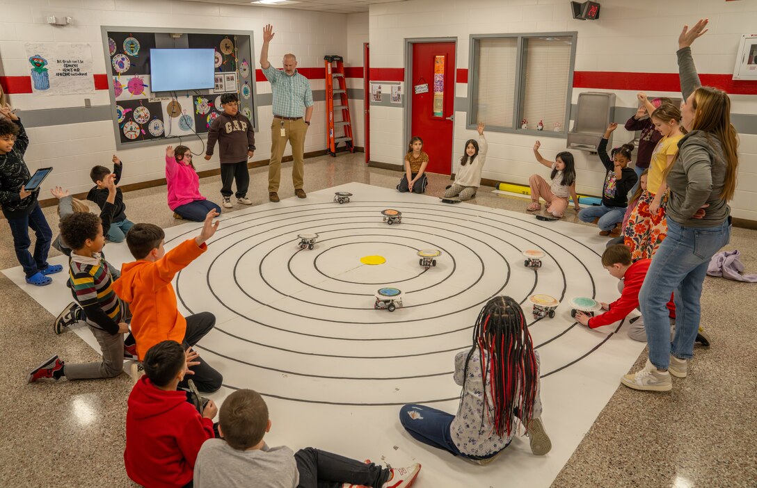 WARSAW, Va. – Preston Ailor, an instructional technology teacher for Richmond County Public Schools, leads a fourth grade class through a science unit on solar systems using Lego robots donated by Naval Surface Warfare Dahlgren Division. The donation is part of NSWCDD’s expansive STEM outreach across regional school districts to build a pipeline for the next generation of scientists and engineers essential to the Navy’s mission. (Dorina Watermolen/NSWCDD Photo)
