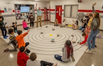 WARSAW, Va. – Preston Ailor, an instructional technology teacher for Richmond County Public Schools, leads a fourth grade class through a science unit on solar systems using Lego robots donated by Naval Surface Warfare Dahlgren Division. The donation is part of NSWCDD’s expansive STEM outreach across regional school districts to build a pipeline for the next generation of scientists and engineers essential to the Navy’s mission. (Dorina Watermolen/NSWCDD Photo)