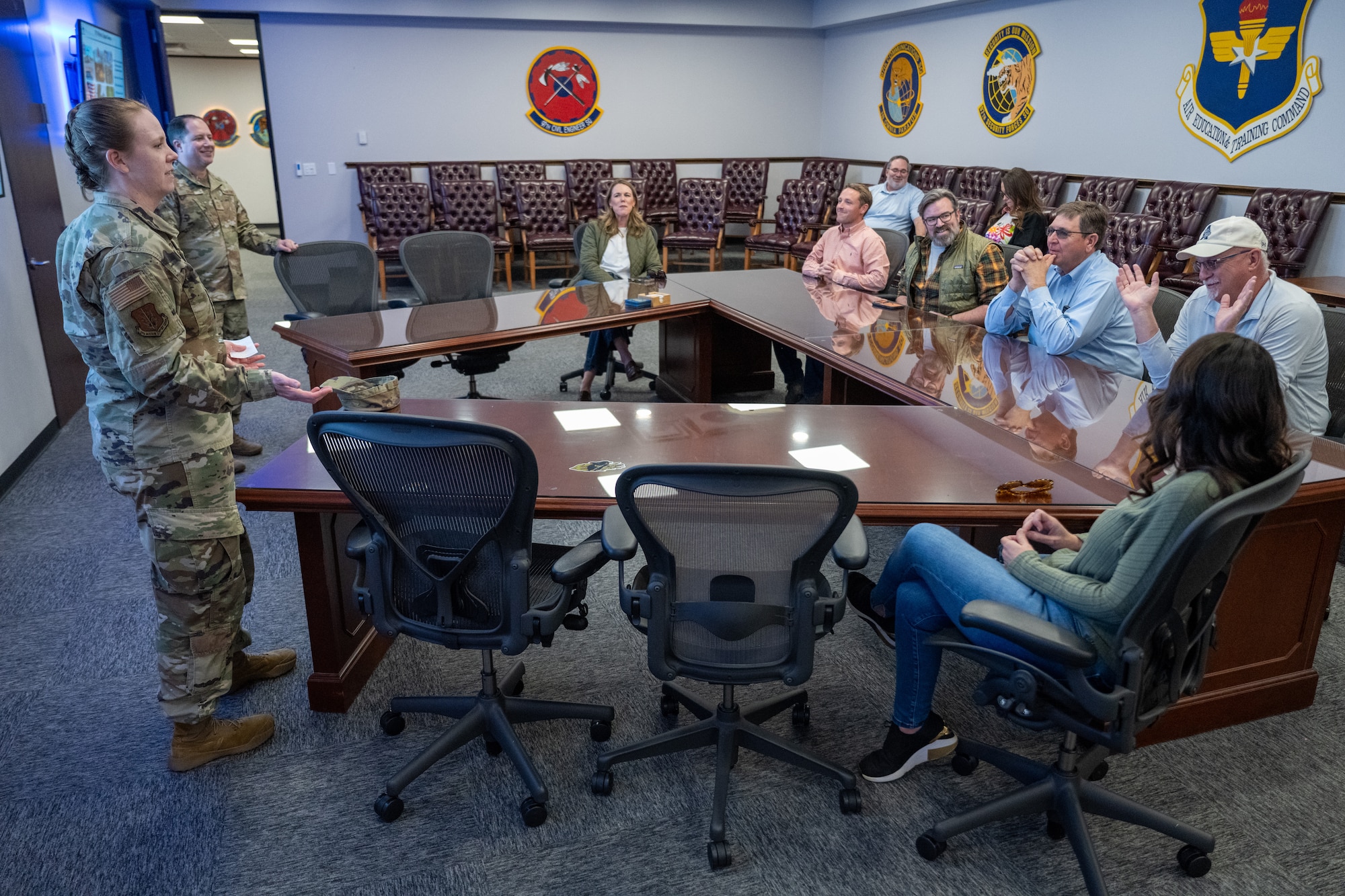 U.S. Air Force Col. Amanda Knotts, 97th Mission Support Group commander, and Chief Master Sgt. Mark Erwin, 97th Mission Support Group senior enlisted leader, brief honorary commanders during a Mission Support Group tour at Altus Air Force Base, Oklahoma, Feb. 6, 2026. The tour familiarized honorary commanders with the group’s mission and support capabilities while strengthening relationships between the installation and the local community. (U.S. Air Force photo by Airman 1st Class Nathan Langston)