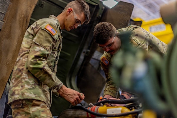 Spc. Emmett Jones (left) and Spc. Layton Richmond (right) from the 1245th Transportation Company, 345th Combat Sustainment Support Battalion, 90th Troop Command, Oklahoma Army National Guard diagnoses an issue on a Light Medium Tactical Vehicle during the OKARNG’s 2026 Best Mechanic competition at the Combined Support Maintenance Shop in Norman, Oklahoma, Feb. 7, 2026. Guardsmen from across the state took part in a series of stations designed to test their skills in diagnostics, technical proficiency, including electrical circuits, measuring and inspection, and the use of the Army’s maintenance management system. (Oklahoma National Guard photo by Sgt. Haden Tolbert)
