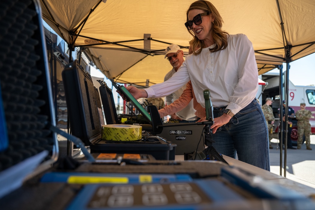 Candace Braddock, 97th Air Mobility Wing honorary deputy commander, views chemical, biological, radiological and nuclear (CBRN) equipment during an immersion tour with the 97th Civil Engineer Squadron at Altus Air Force Base, Oklahoma, Feb. 6, 2026. The visit provided an overview of the squadron’s CBRN response capabilities and the protective gear used to support installation readiness. (U.S. Air Force photo by Airman 1st Class Nathan Langston)