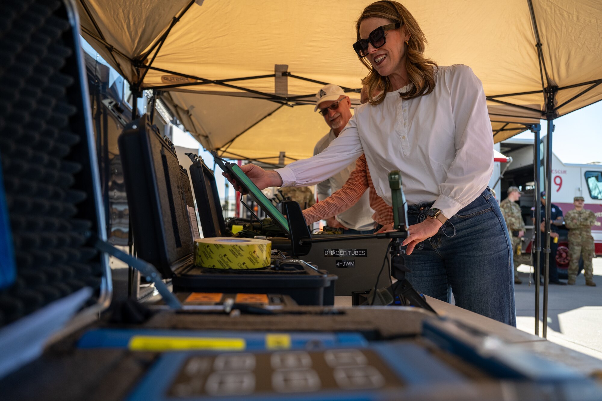 Candace Braddock, 97th Air Mobility Wing honorary deputy commander, views chemical, biological, radiological and nuclear (CBRN) equipment during an immersion tour with the 97th Civil Engineer Squadron at Altus Air Force Base, Oklahoma, Feb. 6, 2026. The visit provided an overview of the squadron’s CBRN response capabilities and the protective gear used to support installation readiness. (U.S. Air Force photo by Airman 1st Class Nathan Langston)