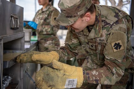 Spc. Kyan Wescott, a member of the 903rd Quartermaster Company, prepares a pineapple upside down cake during the third annual Oklahoma Army National Guard Culinary Excellence Competition in Norman, Oklahoma, Feb. 8, 2026. This year’s OKARNG CEC hosted five teams from the 45th Infantry Brigade Combat Team and 90th Troop Command competing to be named the best team in the state. The competition is designed to recognize outstanding OKARNG cooks. (Oklahoma National Guard photo by Staff Sgt. Anthony Jones)