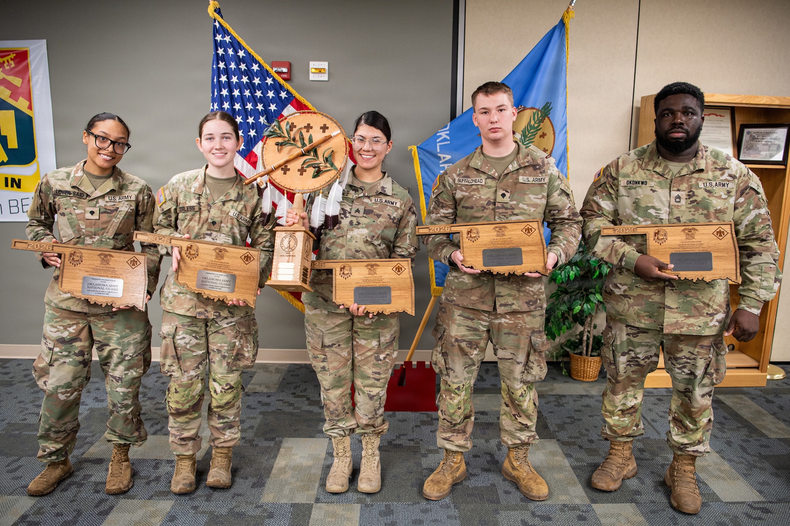 (left to right) Spc. Jasman Lover-Said, Spc. Lindi Corless, Sgt. Juliana Martinez, Spc. Brayden Buffalohead and Sgt. 1st Class Emmanuel Okonkwo, all members of the 903rd Quartermaster Company, pose with their individual and team trophy after winning the third annual Oklahoma Army National Guard Culinary Excellence Competition, in Norman, Oklahoma, Feb. 8, 2026. This win for the 903rd marks the third time in a row a team representing the 903rd has placed first in the competition designed to recognize outstanding OKARNG cooks. (Oklahoma National Guard photo by Staff Sgt. Anthony Jones)