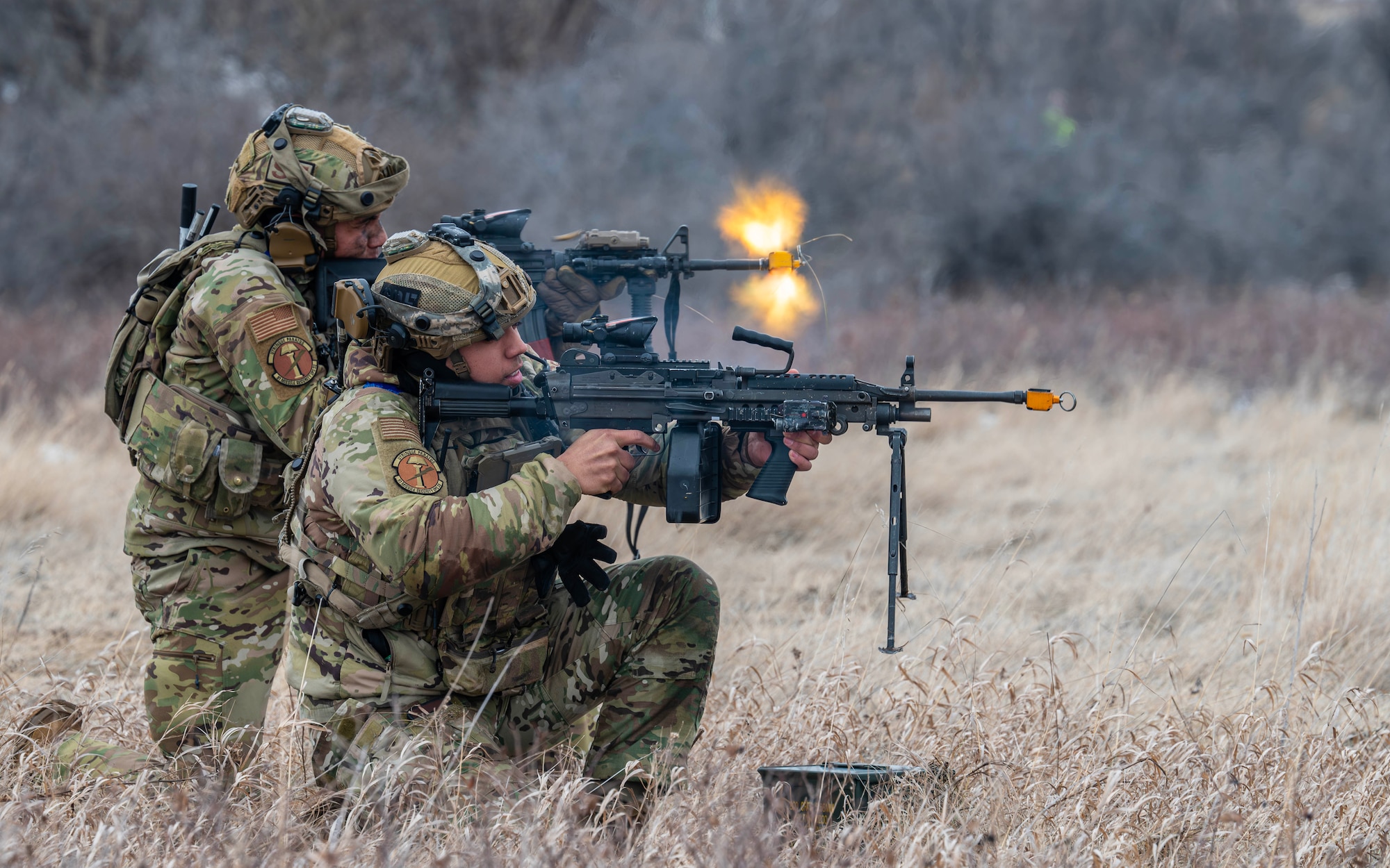 U.S. Air Force Senior Airman Antwan Lunarde (left), and U.S. Air Force Senior Airman David Gomez, 91st Missile Security Operations Squadron convoy team members, engage simulated opposing forces during a force-on-force exercise in Garrison, North Dakota, Feb. 6, 2026. The exercise tested Lunarde, Gomez, and their team’s ability to detect and defeat adversary threats in a contested environment. (U.S. Air Force photo by Senior Airman Kyle Wilson)
