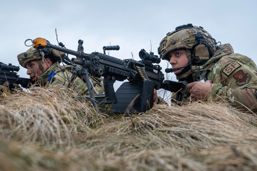 U.S. Air Force Senior Airman Antwan Lunarde (left), and U.S. Air Force Senior Airman David Gomez, 91st Missile Security Operations Squadron convoy team members, provide overwatch security to their team during a force-on-force exercise in Garrison, North Dakota, Feb. 6, 2026. As part of the exercise, Lunarde and Gomez worked with their team to properly identify and neutralize a simulated opposing force. (U.S. Air Force photo by Senior Airman Kyle Wilson)