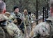 U.S. Air Force 1st Lt. Cole Lautt (center left), 91st Missile Security Operations Squadron (91MSOS) convoy response force flight commander, discusses tactics with his team during a force-on-force exercise at Garrison, North Dakota, Feb. 6, 2026. Lautt emphasized the importance of clear communication and teamwork for mission success. (U.S. Air Force photo by Senior Airman Kyle Wilson)