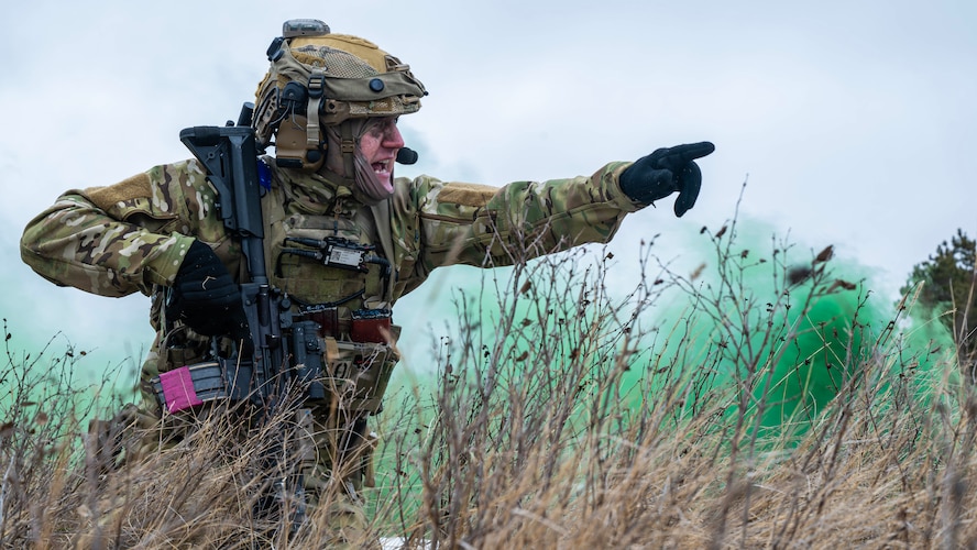 U.S. Air Force Senior Airman Tanner Goldsmith, 91st Missile Security Operations Squadron convoy team member, communicates with his team during a force-on-force exercise in Garrison, North Dakota, Feb. 6, 2026. Goldsmith led his team during an assault on a simulated opposing force’s position. (U.S. Air Force photo by Senior Airman Kyle Wilson)