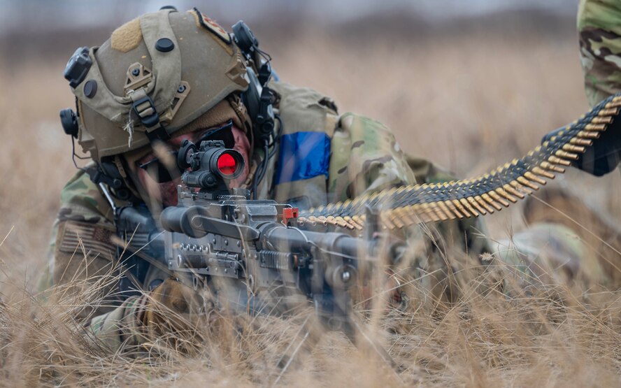 U.S. Air Force Airman 1st Class Ayden Kozlowsky, 91st Missile Security Operations Squadron convoy team member, fires an M240B machine gun during a force-on-force exercise in Garrison, North Dakota, Feb. 6, 2026. Kozlowsky provided suppressing fire for his team to facilitate their movement during the exercise. (U.S. Air Force photo by Senior Airman Kyle Wilson)