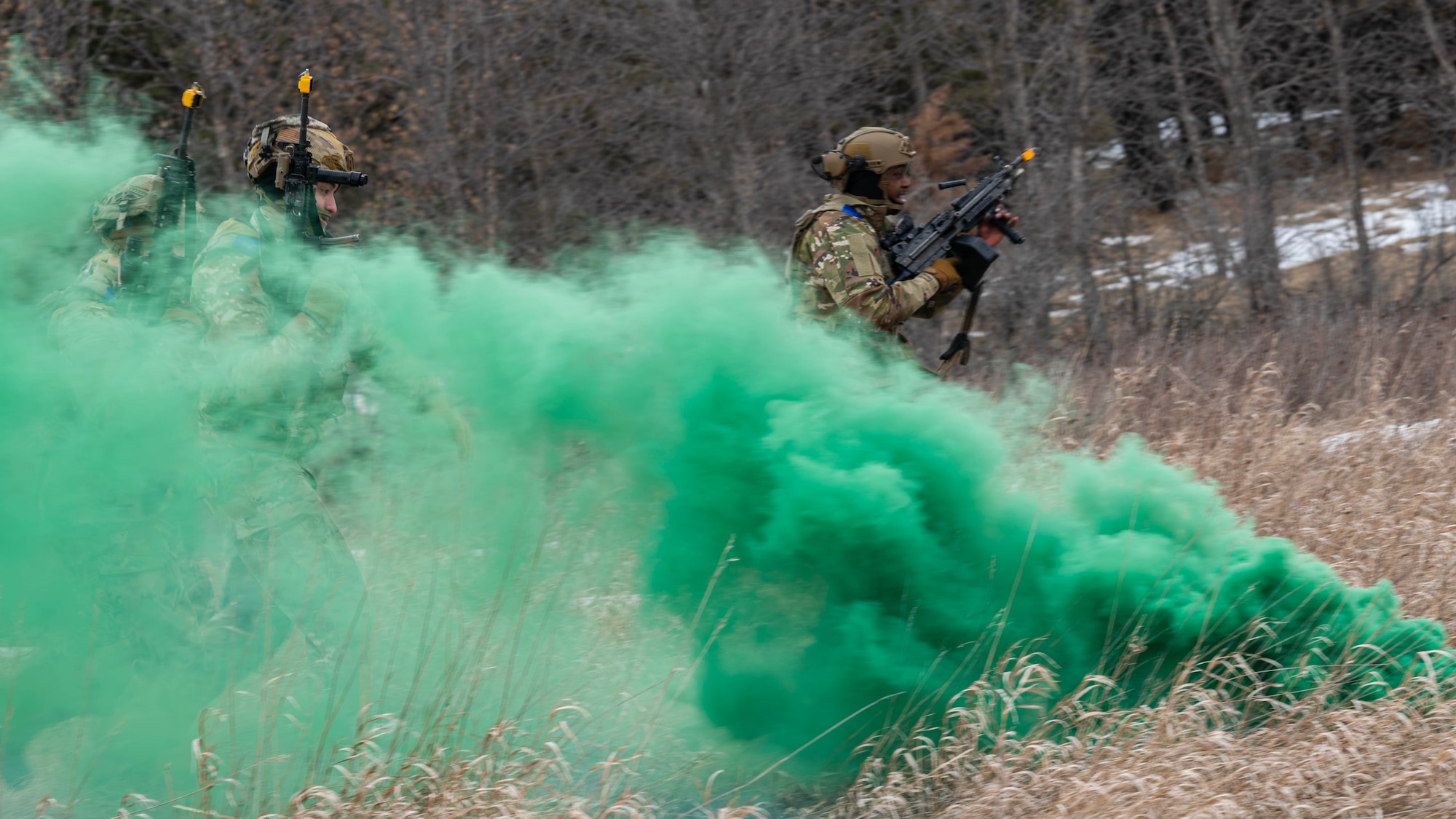 U.S. Airmen assigned to the 91st Missile Security Operations Squadron assault a simulated opposing force during a force-on-force exercise in Garrison, North Dakota, Feb. 6, 2026. The Airmen used a smoke grenade to conceal their movement and positioning. (U.S. Air Force photo by Senior Airman Kyle Wilson)