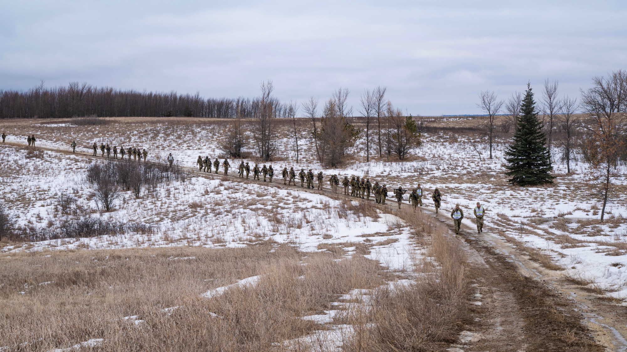 U.S. Airmen assigned to the 91st Missile Security Operations Squadron (91MSOS) ruck through a field training site in Garrison, North Dakota, Feb. 6, 2026. 91MSOS Airmen regularly conduct field training scenarios to validate their readiness and lethality. (U.S. Air Force photo by Senior Airman Kyle Wilson)