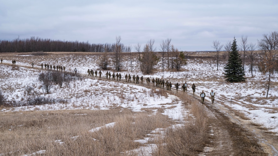 U.S. Airmen assigned to the 91st Missile Security Operations Squadron (91MSOS) ruck through a field training site in Garrison, North Dakota, Feb. 6, 2026. 91MSOS Airmen regularly conduct field training scenarios to validate their readiness and lethality. (U.S. Air Force photo by Senior Airman Kyle Wilson)
