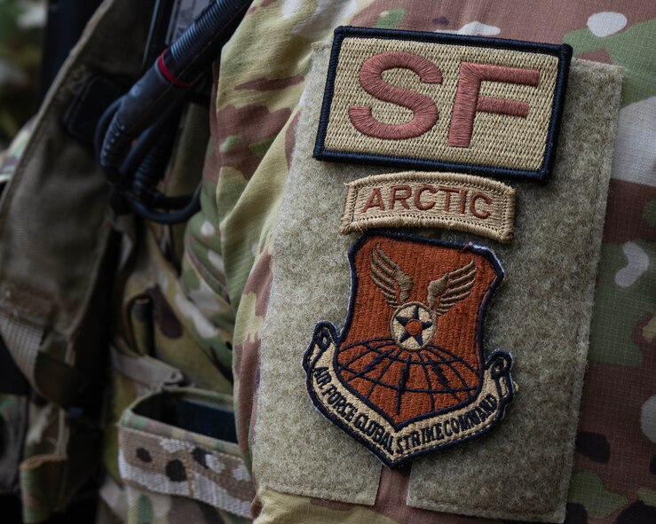 An Arctic tab is worn by U.S. Air Force Tech. Sgt. Andrew Moore, 91st Missile Security Operations Squadron convoy squad leader, during field training in Garrison, North Dakota, Feb. 6, 2026. The Arctic tab is authorized for wear by Airmen who have completed specialized training in Arctic environments and signifies proficiency in cold-weather operations. (U.S. Air Force photo by Senior Airman Kyle Wilson)