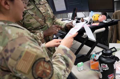 U.S. Air Force Senior Airman Mya Wells and Airman Natalia Cruz, career development technicians, both assigned to the 42d Force Support Squadron Military Personnel Flight, clarify questions at Maxwell Air Force Base, Alabama, Feb. 9, 2026.