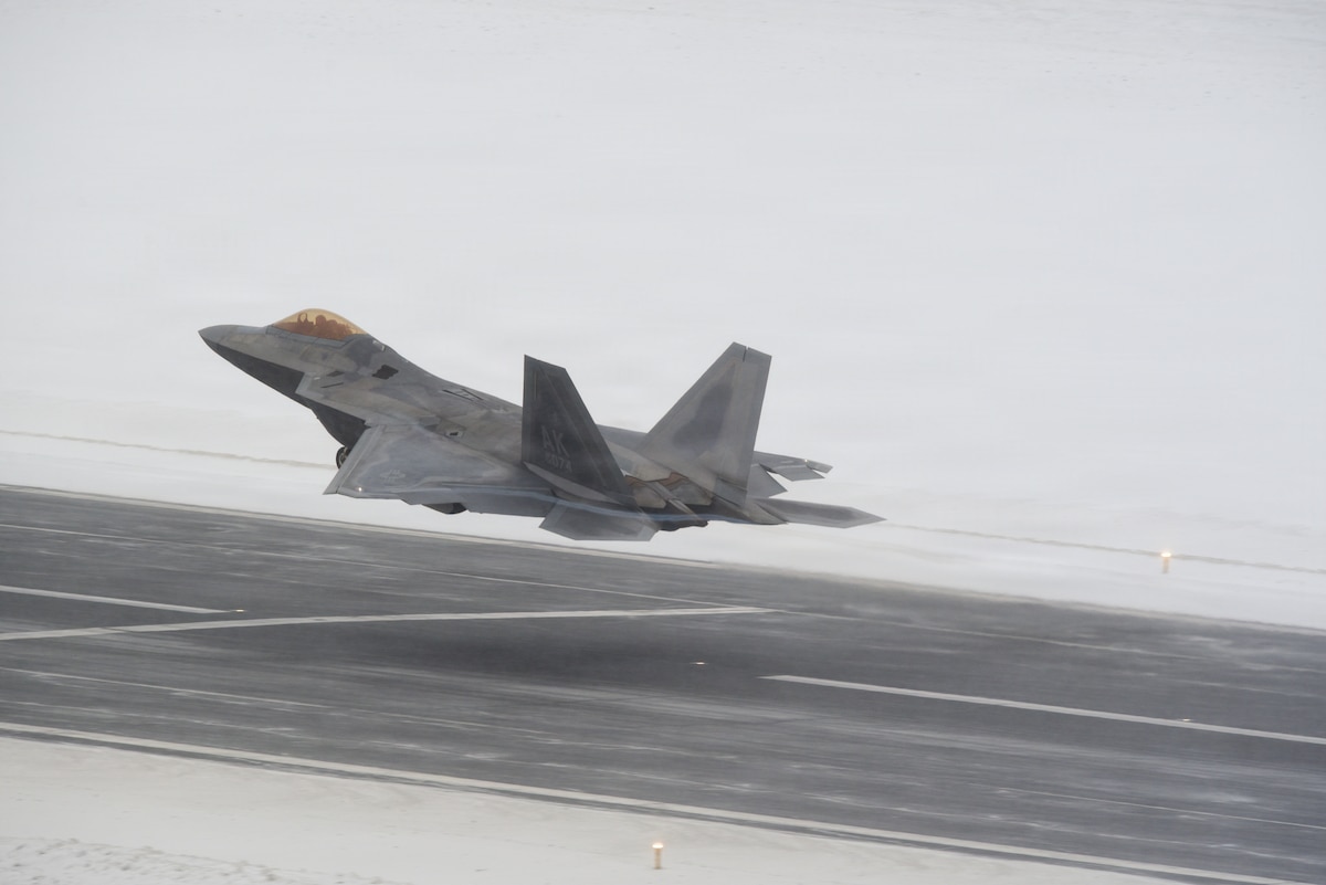 A U.S. Air Force F-22 Raptor assigned to 3rd Wing takes off during snow fall Joint Base Elmendorf-Richardson, Alaska, Feb. 10, 2026. The F-22 Raptor is designed to project air dominance and cannot be matched by any known or projected fighter aircraft, providing power projection across the Indo-Pacific region. (U.S. Air Force photo by Nicholas Holland)