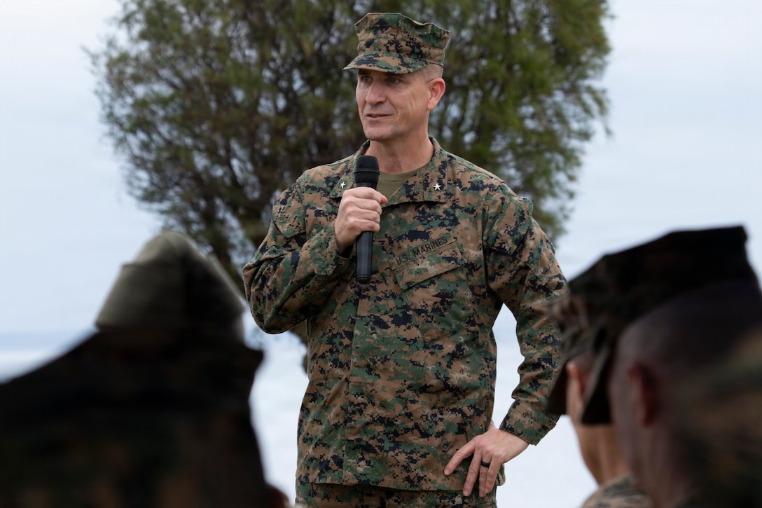 U.S. Marine Corps Brig. Gen. Ryan Hoyle, commanding general of 3rd Marine Expeditionary Brigade, speaks during the unit’s change of command ceremony, Camp Courtney, Okinawa, Japan, Feb. 6, 2026. 3rd MEB hosted the change of command ceremony to formally recognize the total transfer of authority from Brig. Gen. Robert Brodie to Brig. Gen. Ryan Hoyle. The unit conducts combined operations, exercises, and training in support of the III Marine Expeditionary Force to strengthen alliance relationships and enhance regional security. (U.S. Marine Corps photo by Staff Sgt. Shannon Doherty)