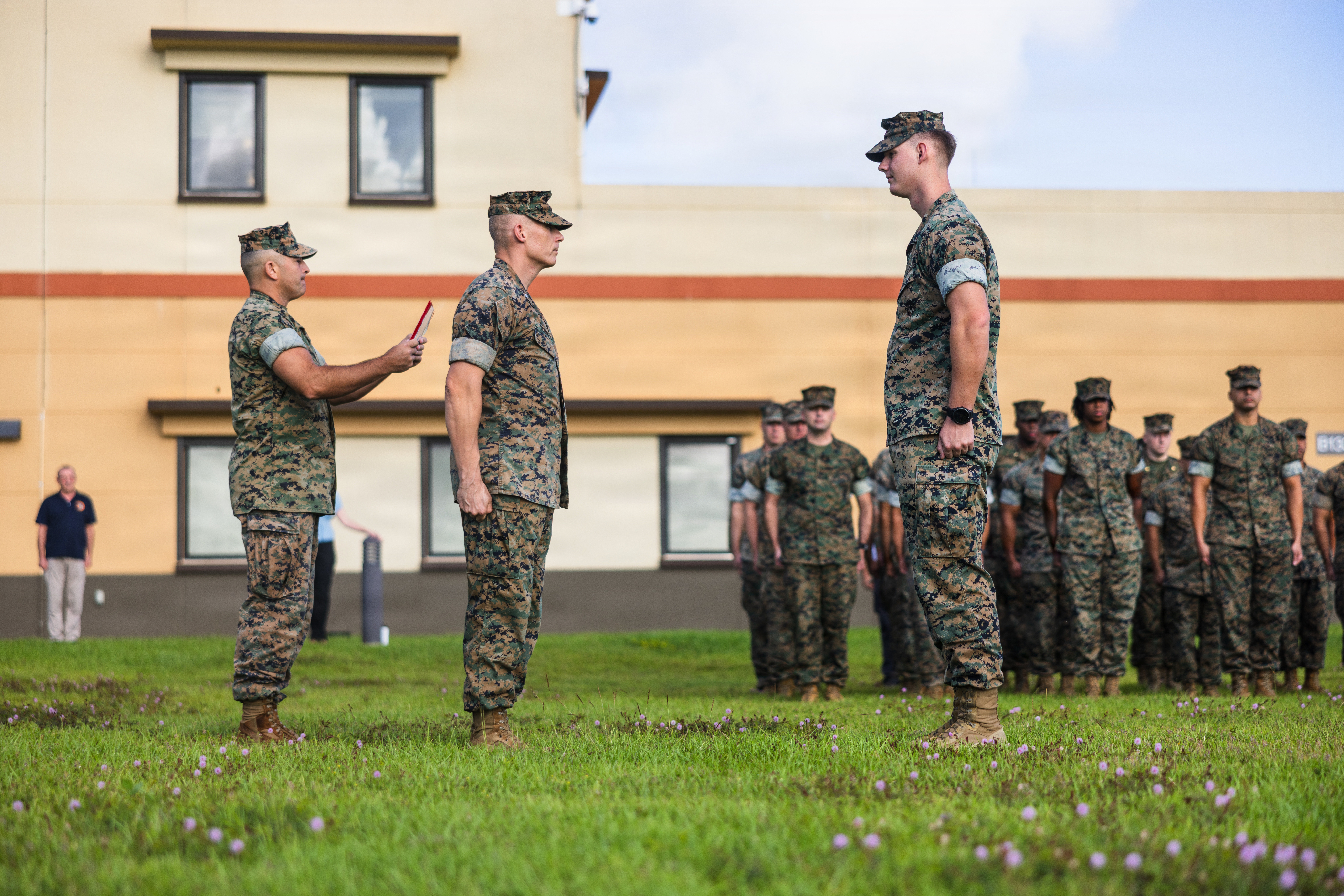 U.S. Marine Corps Sgt. Daniel Kelly, a native of Dallas, Georgia, military police, Provost Marshal’s Office, Marine Corps Base Camp Blaz, stands at attention during an award ceremony on MCB Camp Blaz, Guam, Feb. 6, 2026. Kelly was awarded a Navy and Marine Corps Achievement medal for his outstanding performance as a physical security specialist, helping keep the installation on track to reach full operational capability. (U.S. Marine Corps photo by Sgt. Brayden Daniel)