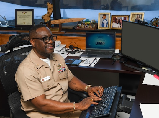 Navy Lt. Cmdr. Edward Abgevey-Tamakloe is awarded the 2025 Navy Medicine Senior Financial Management Officer of the Year