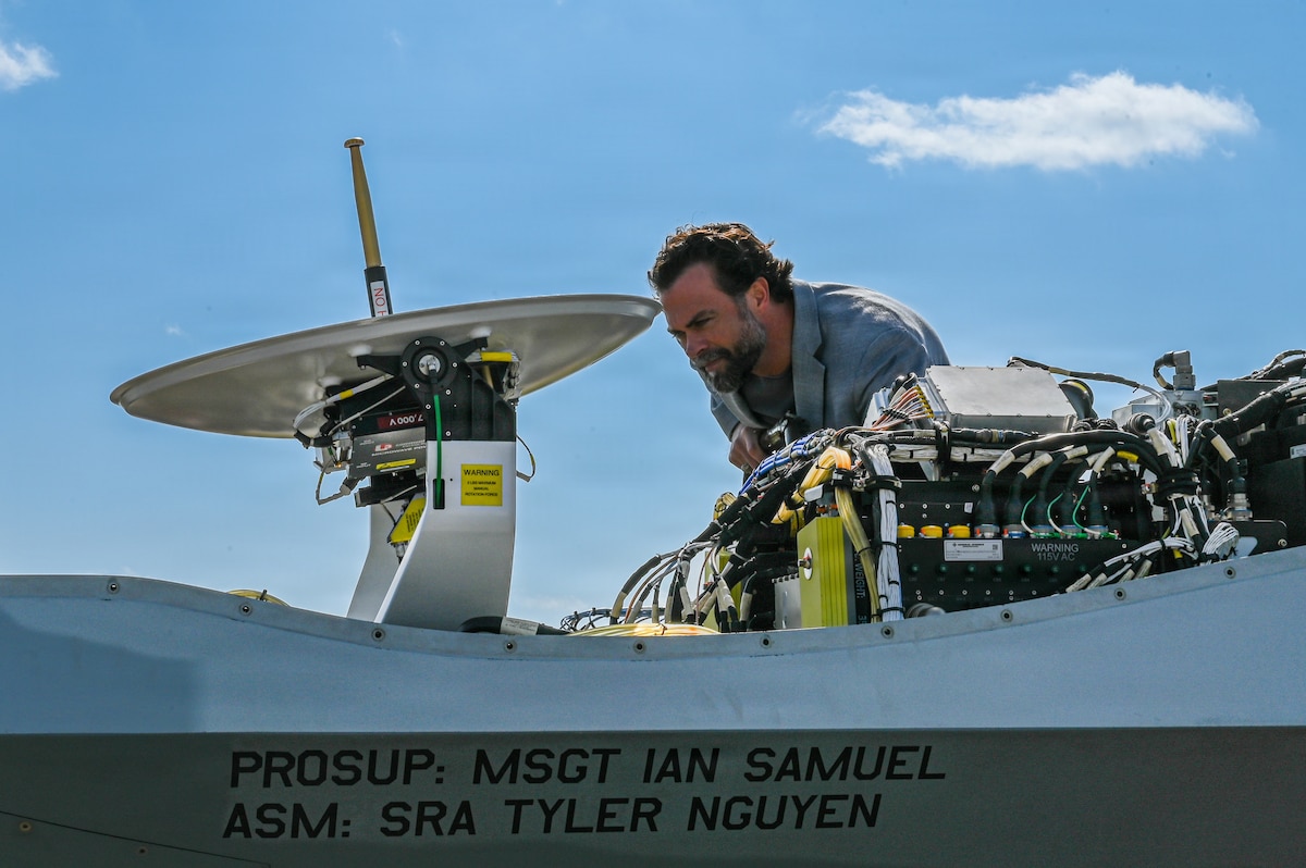 Government official observes aircraft display.