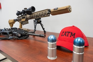 U.S. Air Force 97th Security Forces Squadron Combat Arms Training and Maintenance gear is displayed on a table at Altus Air Force Base, Oklahoma, Feb. 6, 2026. The gear was there for honorary commanders during a 97th Mission Support Group immersion tour. (U.S. Air Force photo by Airman 1st Class Nathan Langston)