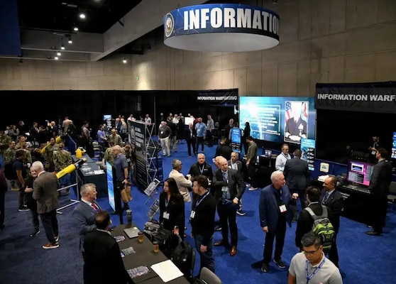 West 2026 attendees mingle through the Navy Information Warfare (IW) Pavilion, Feb 10. The IW pavilion demonstrated the Navy's commitment to warfighting in the information age through the use of speakers, panels, subject matter experts, and capability displays. The premier naval conference and exposition on the WEST Coast, WEST is now in its 36th year of bringing military and industry leaders together. Co-sponsored by AFCEA International and the U.S. Naval Institute, WEST is the only event in which the makers of platforms and the designers of technologies can network, discuss, and demonstrate their solutions in a single locale. (U.S. Navy photo by Robert Fluegel / Released)