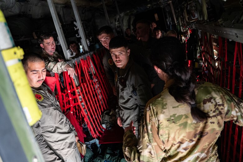 U.S. Marines assigned to the Headquarters and Headquarters Squadron Aircraft Rescue and Firefighting Division receive a tour of a C-130J Super Hercules from U.S. Air Force Capt. Sydney Pasterski, 40th Airlift Squadron pilot, during the Spring 2026 C-130 Weapon System Council at Marine Corps Base Camp Pendleton, California, Feb. 3, 2026. Pasterski answered questions related to emergency equipment and response procedures on the aircraft, strengthening joint safety awareness and coordination between Airmen and I Marine Expeditionary Force personnel. (U.S. Air Force photo by Senior Airman Jade M. Caldwell)