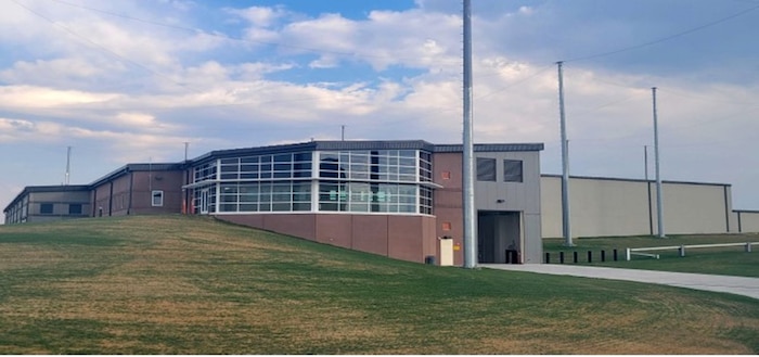Large industrial building on grassy plane