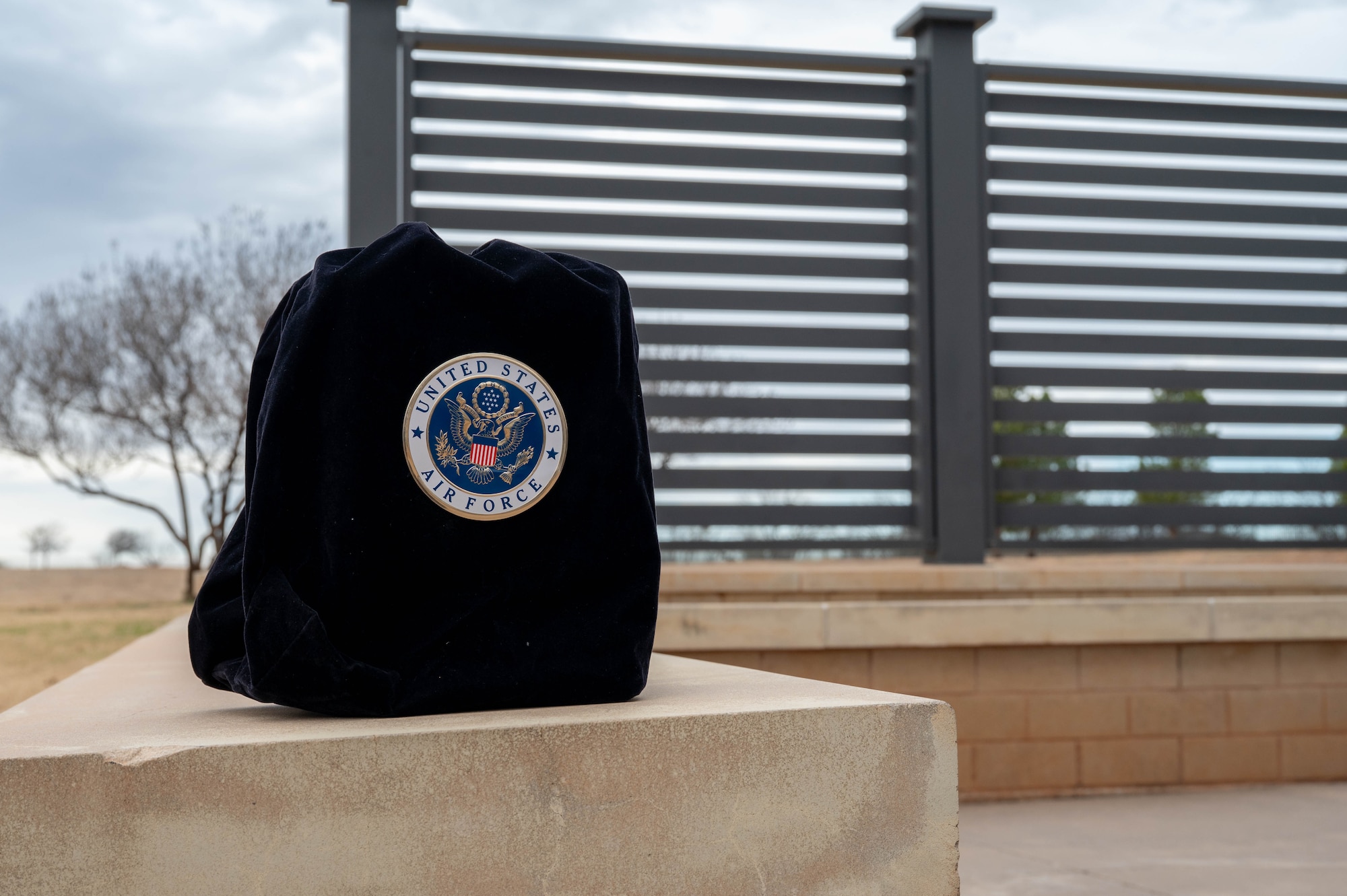 The cremated remains of a U.S. Air Force Veteran rest during a funeral service at the Texas State Veterans Cemetery in Abilene, Texas, Jan. 13, 2026. Military funeral honors take precedence over all other Dyess Air Force Base Honor Guard activities or ceremonies. (U.S. Air Force photo by Airman William Neal)