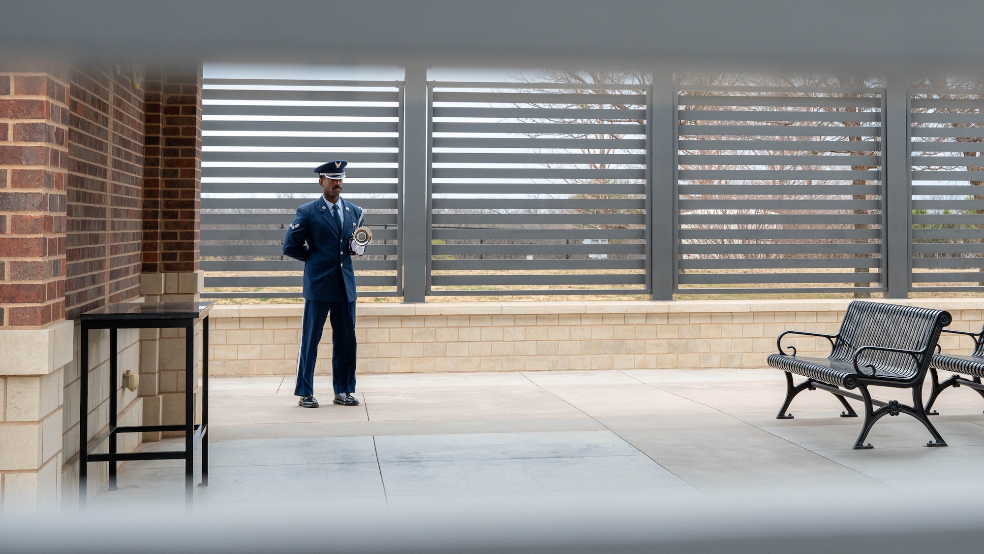 U.S. Air Force Airman 1st Class Bradley Belizaire, 7th Force Support Squadron ceremonial guardsman, awaits the arrival of family members during a funeral service at the Texas State Veterans Cemetery in Abilene, Texas, Jan. 13, 2026. Airmen from a variety of career fields volunteer to serve on the Dyess Honor Guard, safeguarding the traditions of the Air Force and honoring those who served before them. (U.S. Air Force photo by Airman William Neal)