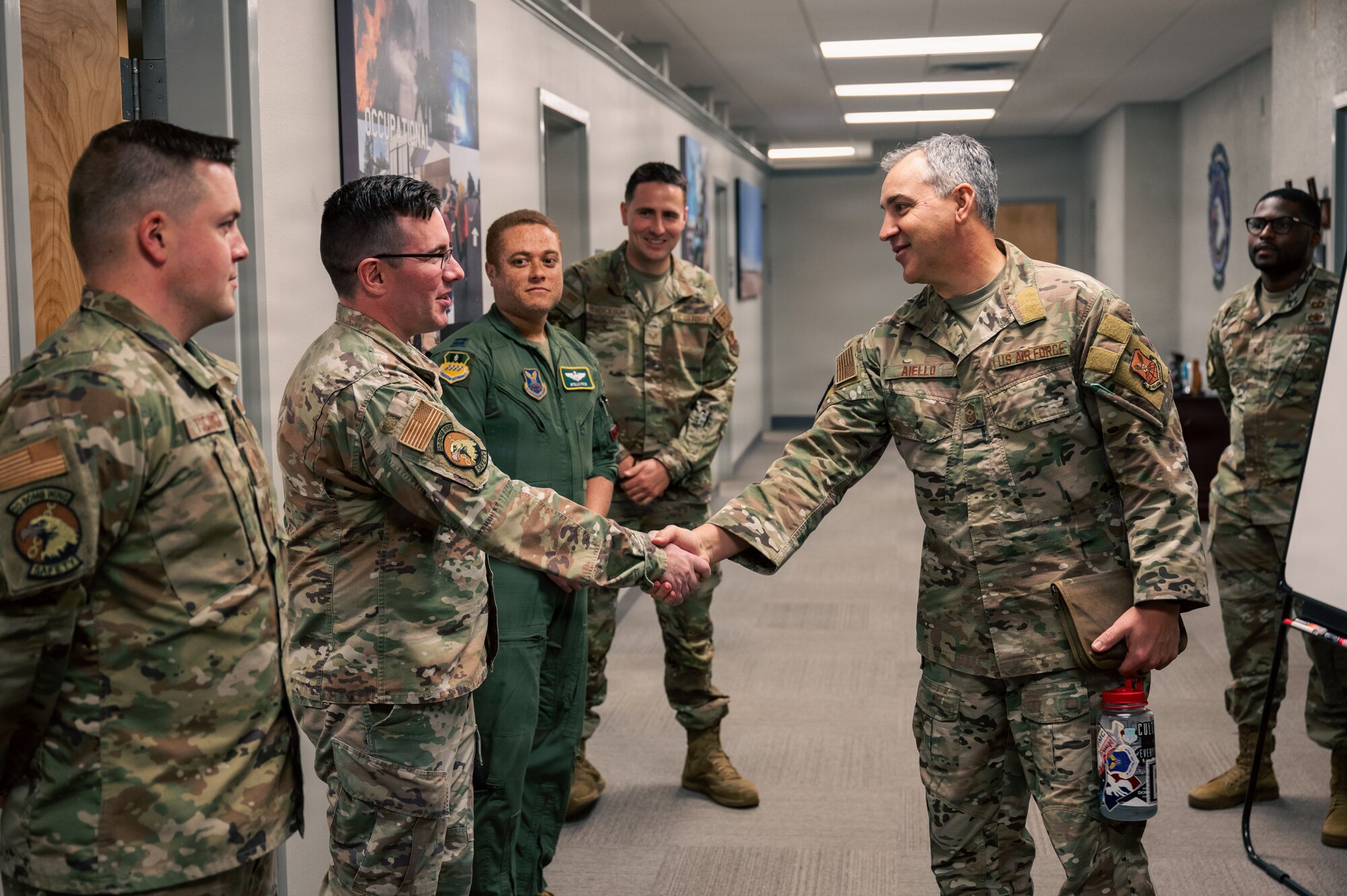 U.S. Air Force Chief Master Sgt. Shawn M. Aiello, right, Air Force Global Strike Command command chief, meets the 2nd Bomb Wing Safety team during a tour at Barksdale Air Force Base, Louisiana, Feb. 3, 2026. During his visit with 2 BW Safety, Aiello spoke with Airmen about some of the most common safety concerns, what can be done to mitigate risks and ensure the safety of Airmen on base so they can continue their mission safely. (U.S. Air Force photo by Senior Airman Seth Watson)