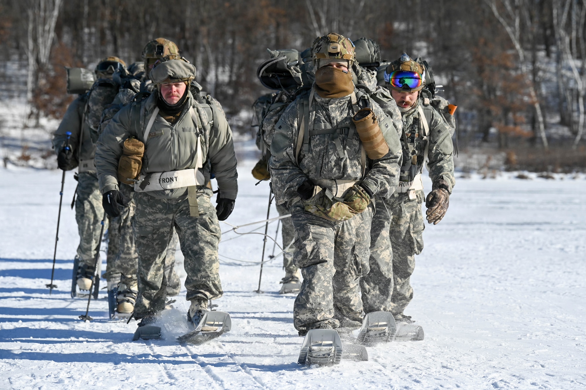 Air National Guard Security Forces specialists ruck across a frozen lake as part of the Air National Guard's Cold Weather Operations Course (CWOC) at Camp Ripley Training Center, Minn. January 30, 2026. The two-week CWOC course combined classroom instruction, outdoor skill development, and a field training event that required students to operate and sleep outdoors, incorporate land navigation, life saving skills, and a cold water immersion event. 57 students from Air National Guard wings from across the U.S. and Canada completed this cold weather survival course hosted by personnel assigned to the 148th Fighter Wing, Minnesota Air National Guard. (U.S. Air National Guard photo by Senior Airman Addie Peterson)