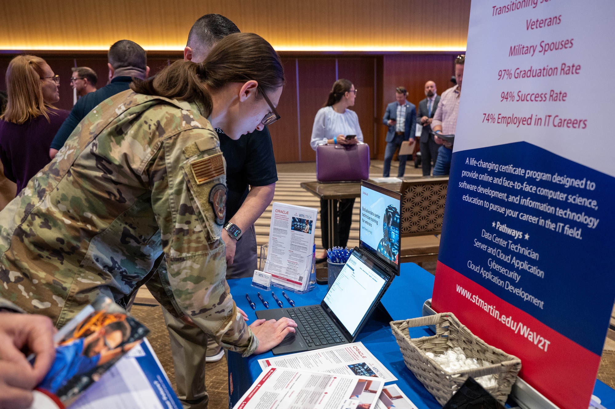 A U.S. Air Force service member fills out an application in the career fair portion of a career summit at Kadena Air Base, Japan, Feb. 5, 2026. The event connected attendees with regional and national employers, expanding access to career opportunities and professional networks. (U.S. Air Force photo by Airman 1st Class Francisco Huerta)