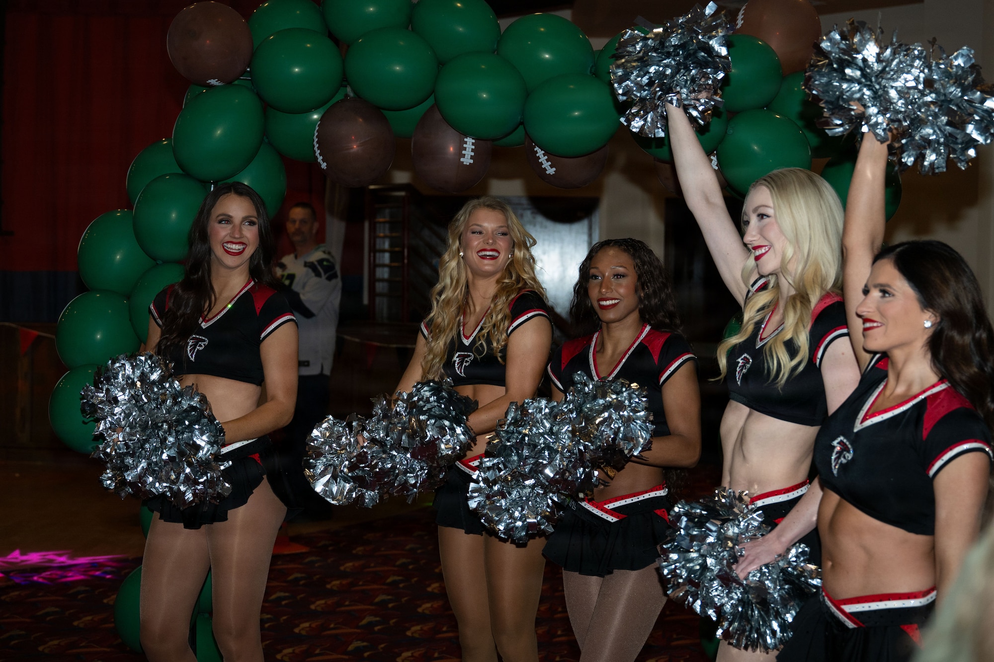 The Atlanta Falcons cheerleaders attend the 100th Mission Support Group annual awards ceremony during a Pro Blitz Armed Forces Entertainment visit at RAF Mildenhall, England Jan. 30, 2026.