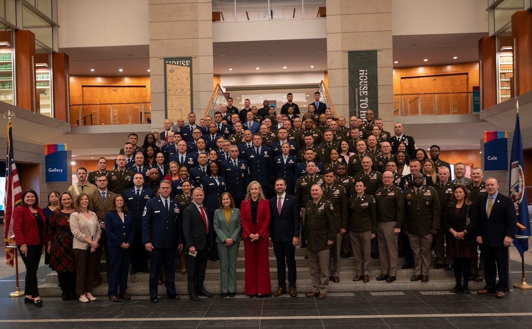 VNG Soldiers, Airmen and alumni pose for a group photo with Gov. Spanberger, Lt. Gov. Hashmi, and Sec. Williams