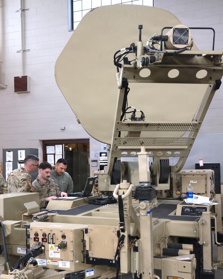 U.S. Army signal specialists assigned to the 32nd Infantry Brigade Combat Team, Wisconsin Army National Guard, operate a satellite transportable terminal during a combined signal exercise at Camp Douglas in Central Wisconsin, Jan. 31, 2026. The annual exercise, hosted by the 32nd Infantry Brigade Combat Team S6, included more than 100 signal Soldiers from multiple major subordinate commands and focused on the complex communications environments they are likely to encounter during state emergencies and future wars. (U.S. National Guard photo by Paul Gorman)