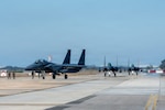 Republic of Korea Air Force F-15K Slam Eagles taxi to parking after arriving at Kunsan Air Base, ROK, Nov. 3, 2025, during Freedom Flag 25-2. FF 25-2 is a routine, regularly scheduled training event designed to prepare joint and combined forces for combat to defend the Republic of Korea.