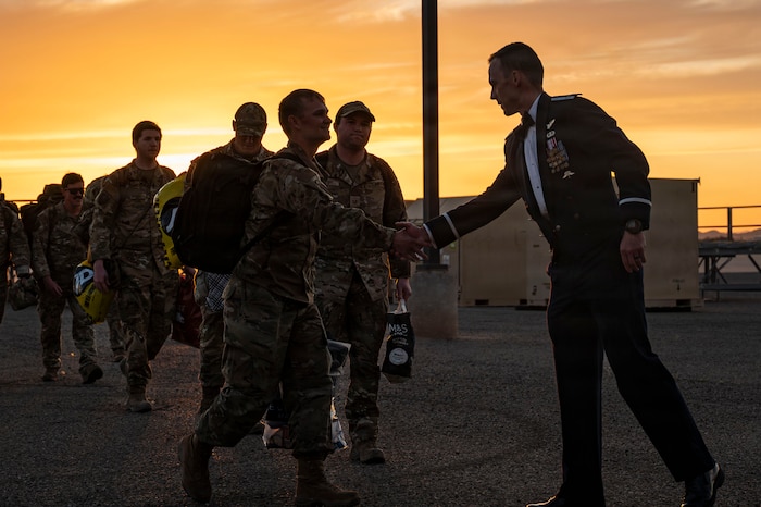 U.S. Air Force Col. Nicholas Morgans, 563rd Rescue Group commander, welcomes 55th Rescue Squadron Airmen returning from deployment at Davis-Monthan Air Force Base, Arizona, Feb. 6, 2026. The 55th RQS is part of the 563rd RQG, which directs flying operations for one of the USAF’s only active-duty wings dedicated to the combat search and rescue mission. (U.S. Air Force photo by Airman 1st Class Samantha Melecio)