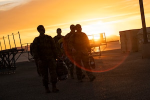 U.S. Air Force Airmen assigned to the 55th Rescue Squadron walk towards friends and family after a redeployment at Davis-Monthan Air Force Base, Arizona, Feb. 6, 2026. The redeployment marked the conclusion of a months-long deployment in the Middle East. (U.S. Air Force photo by Airman 1st Class Samantha Melecio)
