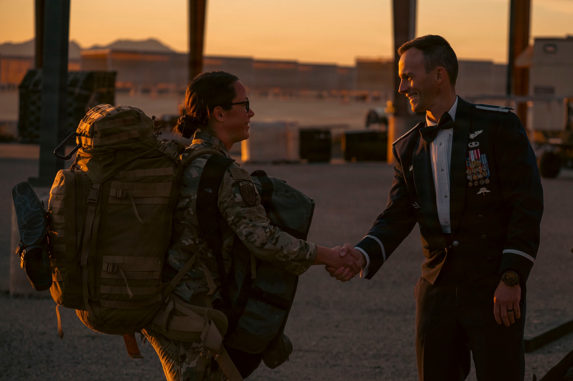 U.S. Air Force Col. Nicholas Morgans, 563rd Rescue Group commander, welcomes an Airman assigned to the 55th Rescue Squadron from redeployment at Davis-Monthan Air Force Base, Arizona, Feb. 6, 2026. Airmen were welcomed home by leadership and thanked for their service during their deployment to the Middle East. (U.S. Air Force photo by Airman 1st Class Samantha Melecio)