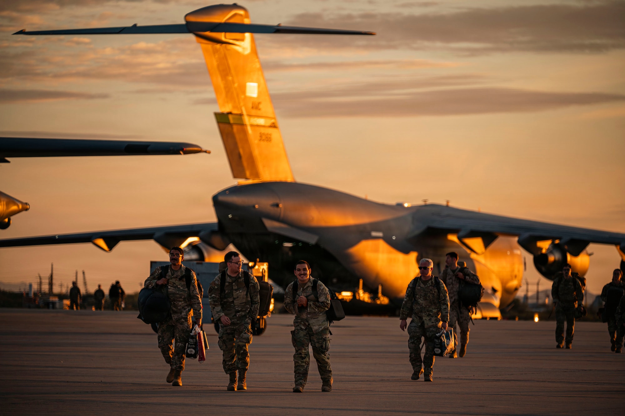 U.S. Air Force Airmen assigned to the 55th Rescue Squadron walk towards friends and family after a redeployment at Davis-Monthan Air Force Base, Arizona, Feb. 6, 2026. Airmen returned to their friends and family after four months deployed in the Middle East. (U.S. Air Force photo by Airman 1st Class Samantha Melecio)